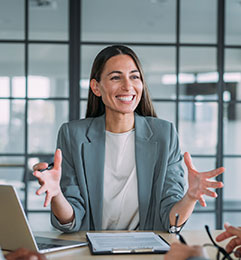 Business woman conducting an office meeting
